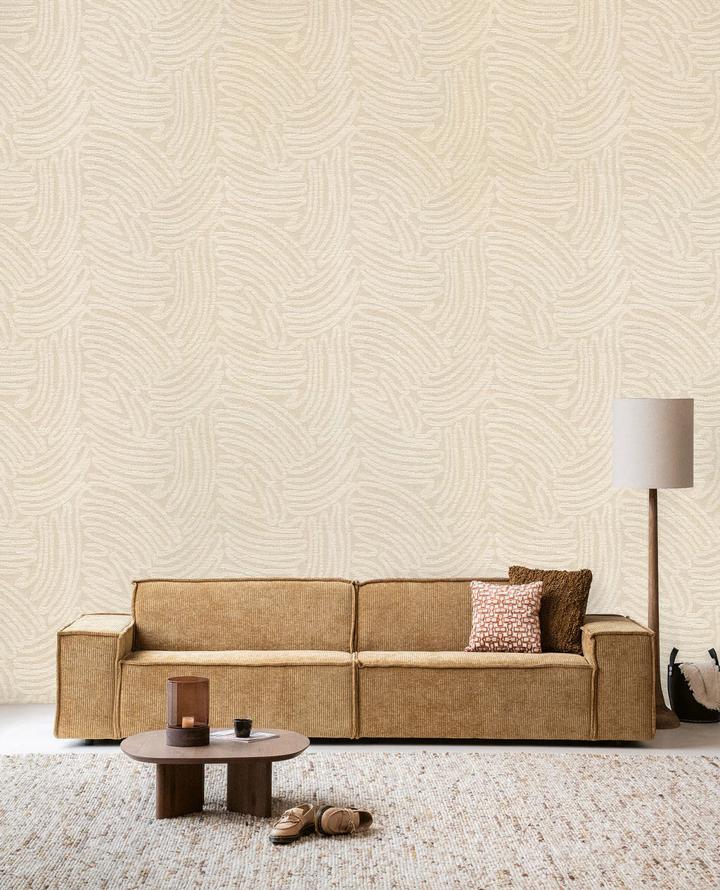 Soft Plaster Mural in beige behind a caramel sofa in a living room