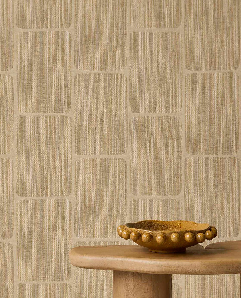 Woven Grid wallpaper in straw yellow behind a timber side table and bowl