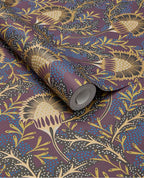 Banksia Bloom wallpaper by Eijffinger in plum purple with golden thistle blooms and blue dots, shown on a curled swatch