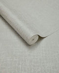 Burnished Weave wallpaper by Eijffinger, partly unrolled roll in pale silvery grey with a shimmering woven texture