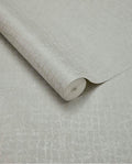 Burnished Weave wallpaper by Eijffinger, partly unrolled roll in pale silvery grey with a shimmering woven texture