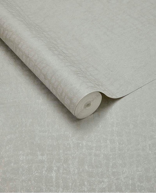 Burnished Weave wallpaper by Eijffinger, partly unrolled roll in pale silvery grey with a shimmering woven texture