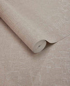 Bark Wash wallpaper by Eijffinger, rolled swatch in soft blush taupe with subtle pink undertones and crackle texture