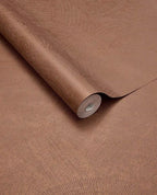 Scallop Fan wallpaper by Eijffinger, rolled swatch in warm terracotta copper showing the overlapping scallop fan motif