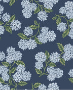 Hydrangea Bloom wallpaper by Eijffinger, pale blue hydrangea heads with green leaves on navy, flat swatch.
