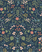 Wildflower Meadow wallpaper by Eijffinger, scattered wildflowers and trailing foliage in coral, blue and green on a deep navy ground, flat swatch.