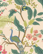 Peacock Perch wallpaper by Eijffinger, blue peacock among leafy branches and coral roses on a soft blush pink ground, flat swatch.