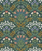 Tapestry Bloom wallpaper by Eijffinger, mirrored floral motifs in green, gold and coral on a deep forest green ground, flat swatch.