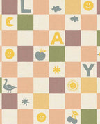 Alphabet Play wallpaper by Eijffinger in mauve, peach and yellow pastels, checkerboard of letters and cheerful icons