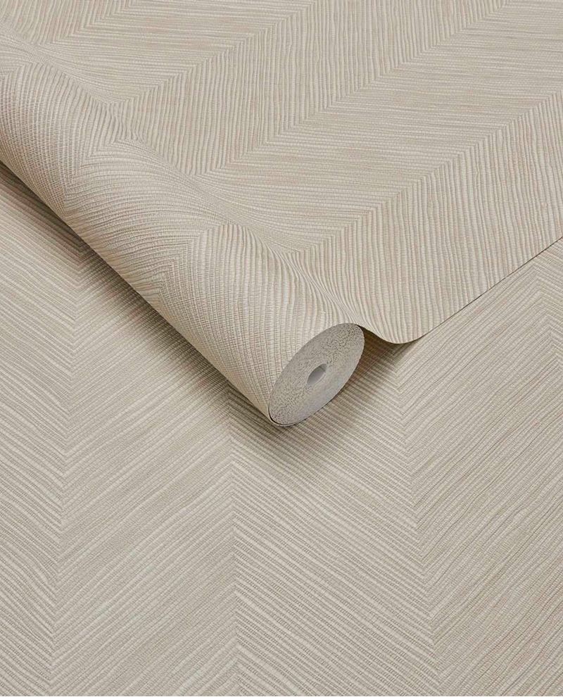 Woven Herringbone wallpaper by Eijffinger in pale oatmeal, subtle herringbone weave shown as an unrolled roll