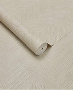 Woven Herringbone wallpaper by Eijffinger in light beige, woven chevron texture on a partly unrolled roll