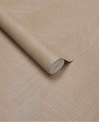 Woven Herringbone wallpaper by Eijffinger in soft tan, linen-textured herringbone shown as a partly unrolled roll