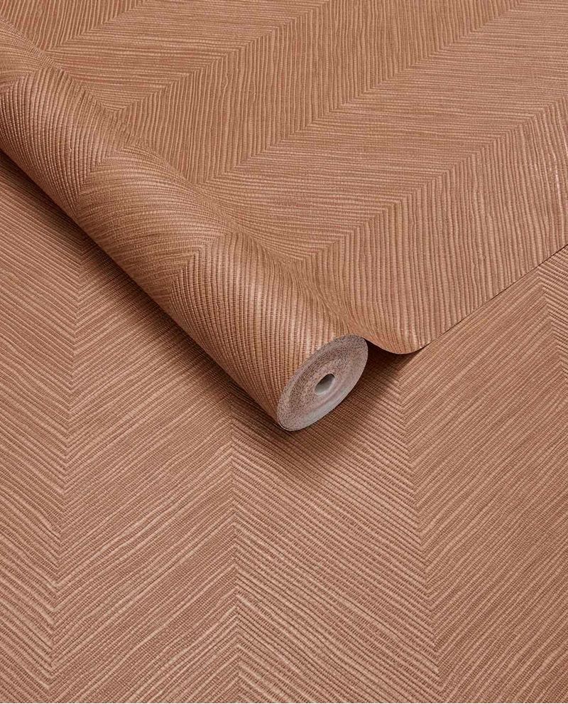 Woven Herringbone wallpaper by Eijffinger in terracotta clay, woven herringbone texture shown as a roll