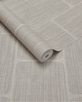 Woven Grid wallpaper by Eijffinger in pale grey-beige, grasscloth weave with grid panel outlines, rolled product shot