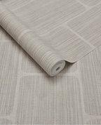 Woven Grid wallpaper by Eijffinger in pale grey-beige, grasscloth weave with grid panel outlines, rolled product shot
