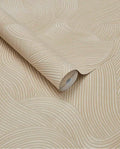 Raked Sand wallpaper by Eijffinger in warm golden sand, raked-sand combed wave relief texture, rolled product shot