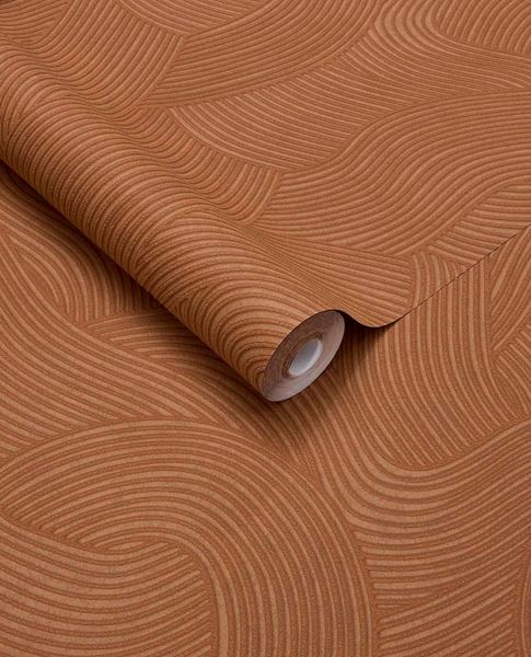Raked Sand wallpaper by Eijffinger in terracotta rust, raked-sand combed wave relief texture, rolled product shot