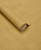 Raked Sand wallpaper by Eijffinger in mustard ochre, raked-sand combed wave relief texture, rolled product shot