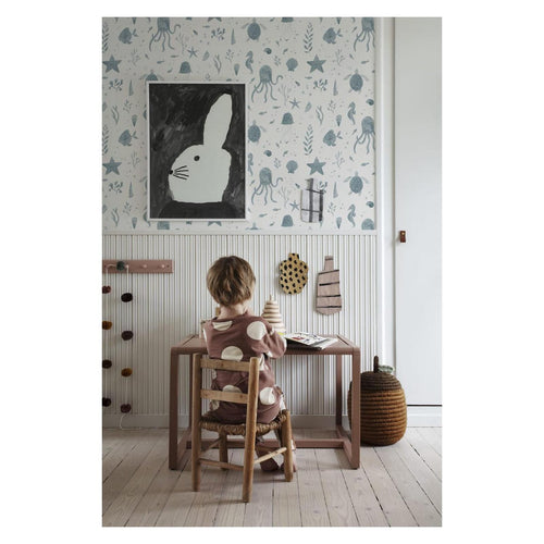 Della wallpaper by Sandberg in blue-grey, in a child's room above panelling with a rabbit print