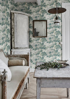 Raphael wallpaper by Sandberg in Green in a rustic room with a weathered timber table, antique mirror and pale linen sofa