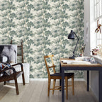 Raphael wallpaper by Sandberg in Green in a home office with a navy desk, wooden chair and black task lamp