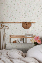 Sanna Sweet Pea wallpaper by Sandberg in white pink sweet pea print behind a bedroom shelf with peonies