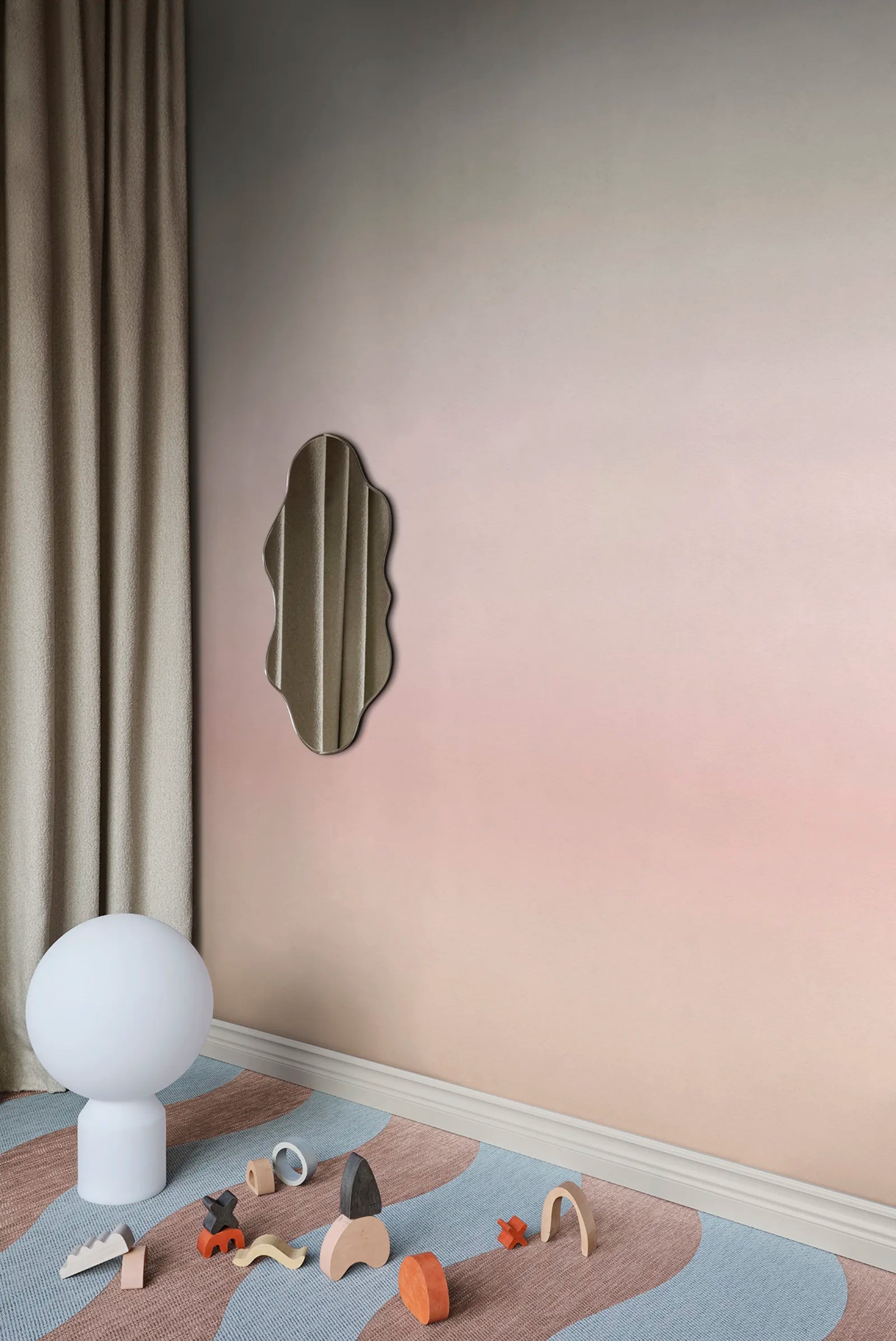 Skymning wall mural by Sandberg, grey-to-blush ombré sky styled in a corner with linen curtain and wavy mirror
