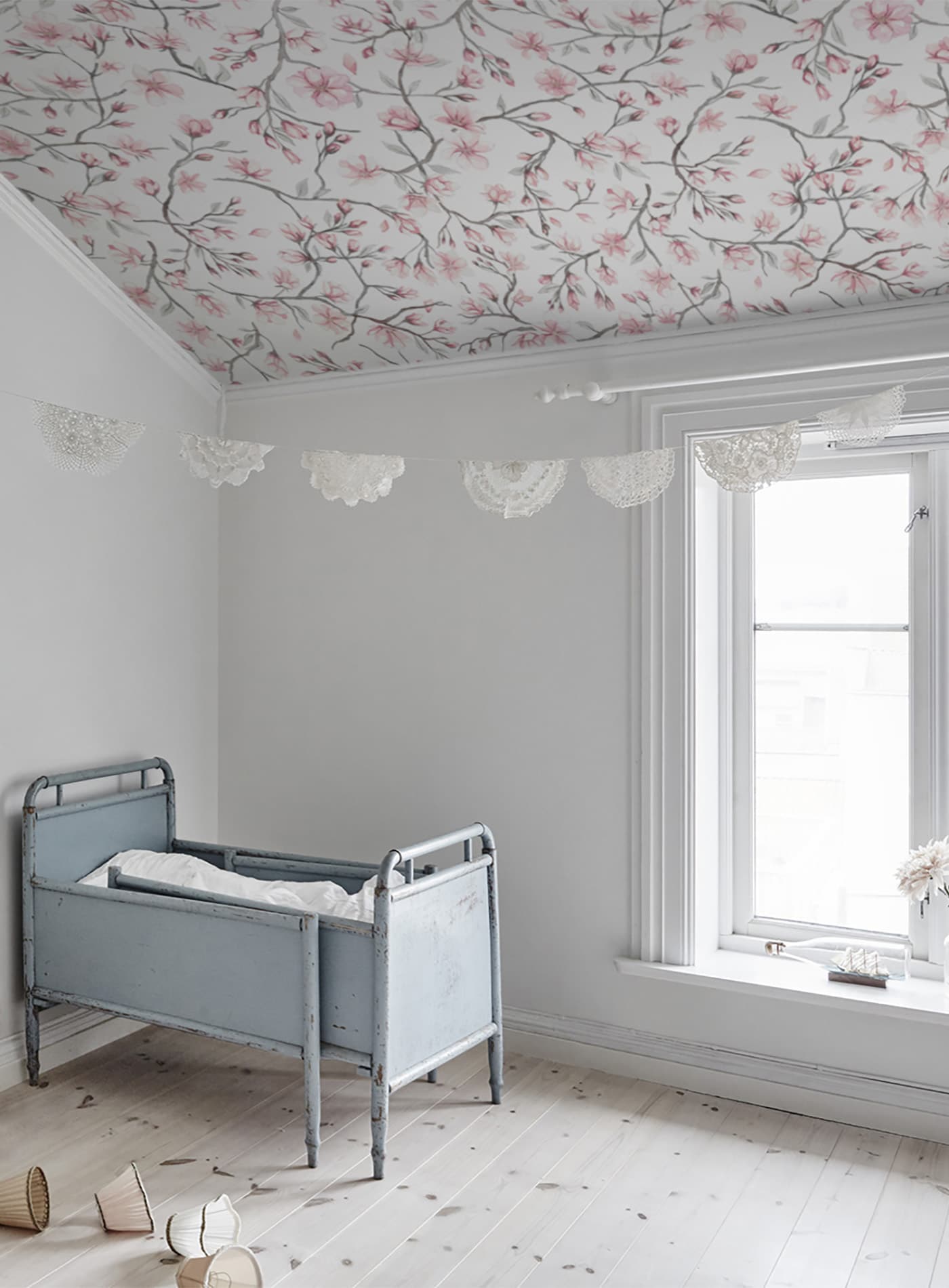 Sakura Sky wallpaper by Sandberg in Pink, styled on an interior wall
