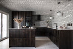 Zen wallpaper by Sandberg in charcoal looping print across the walls and ceiling of a dark timber kitchen