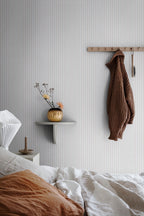 Estelle wallpaper by Sandberg in Sandstone, styled on an interior wall