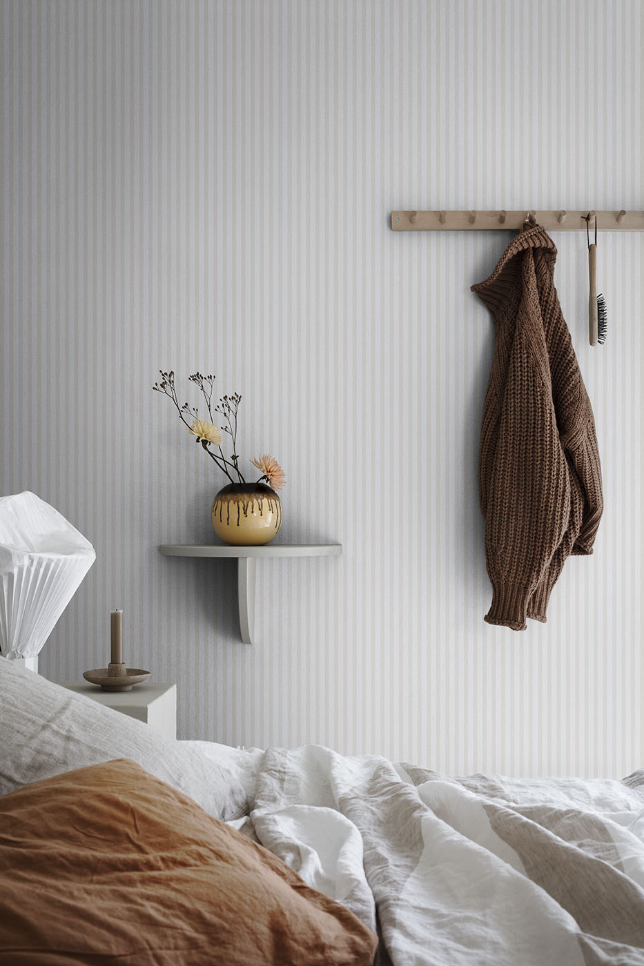 Estelle wallpaper by Sandberg in Sandstone, styled on an interior wall