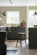 Estelle wallpaper by Sandberg in Mustard, styled on an interior wall