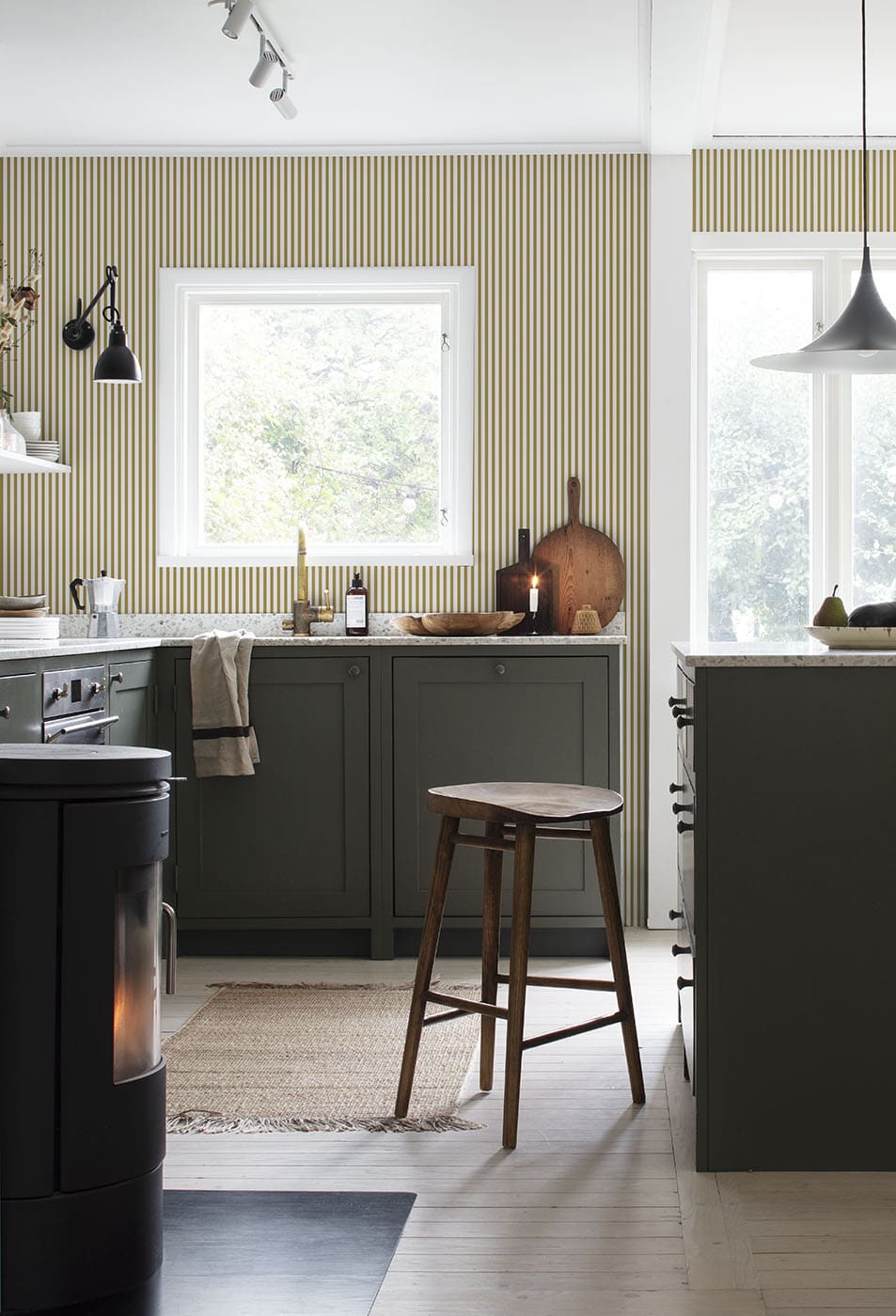 Estelle wallpaper by Sandberg in Mustard, styled on an interior wall