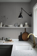 Estelle wallpaper by Sandberg in Graphite, styled on an interior wall