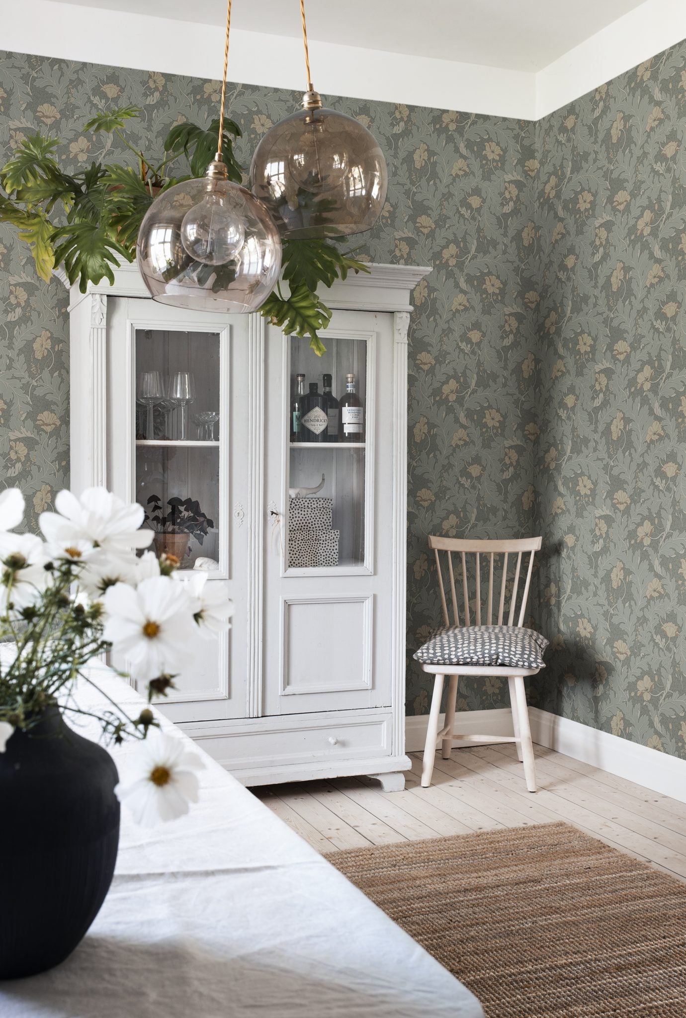 Charlotta wallpaper by Sandberg in Forest Green, styled on an interior wall