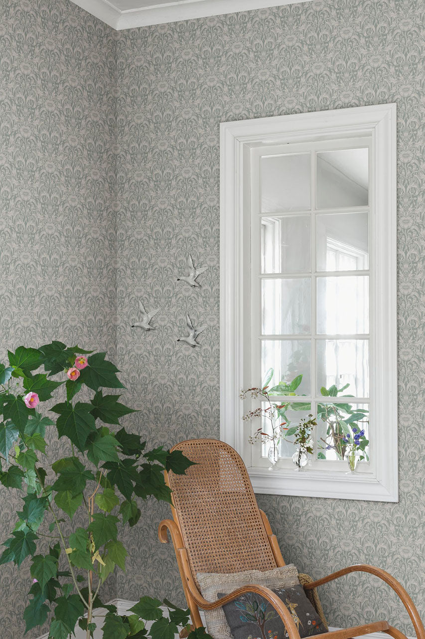 Emil wallpaper by Sandberg in Garden Green, styled on an interior wall
