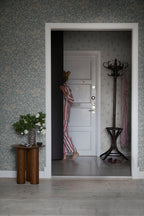 Linnea wallpaper by Sandberg in Misty Blue, styled on an interior wall