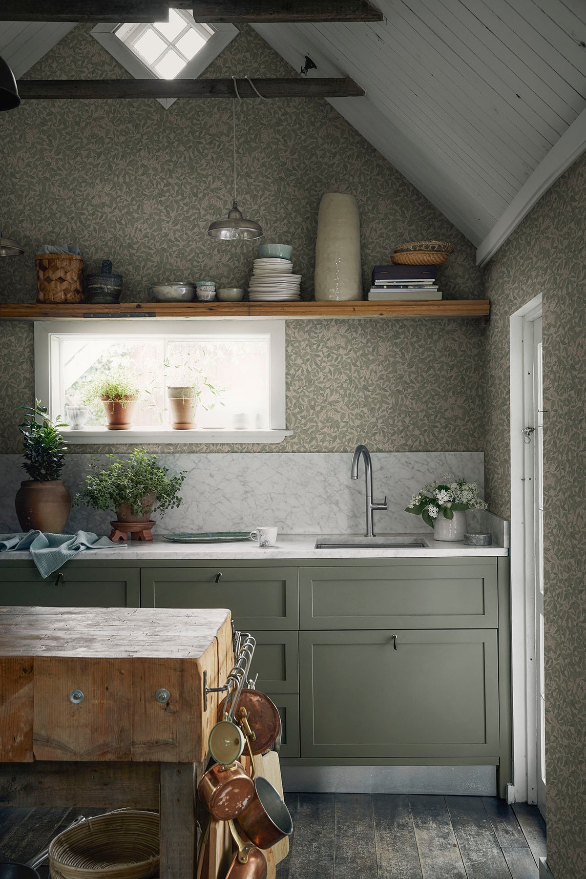 Linnea wallpaper by Sandberg in Garden Green, styled on an interior wall