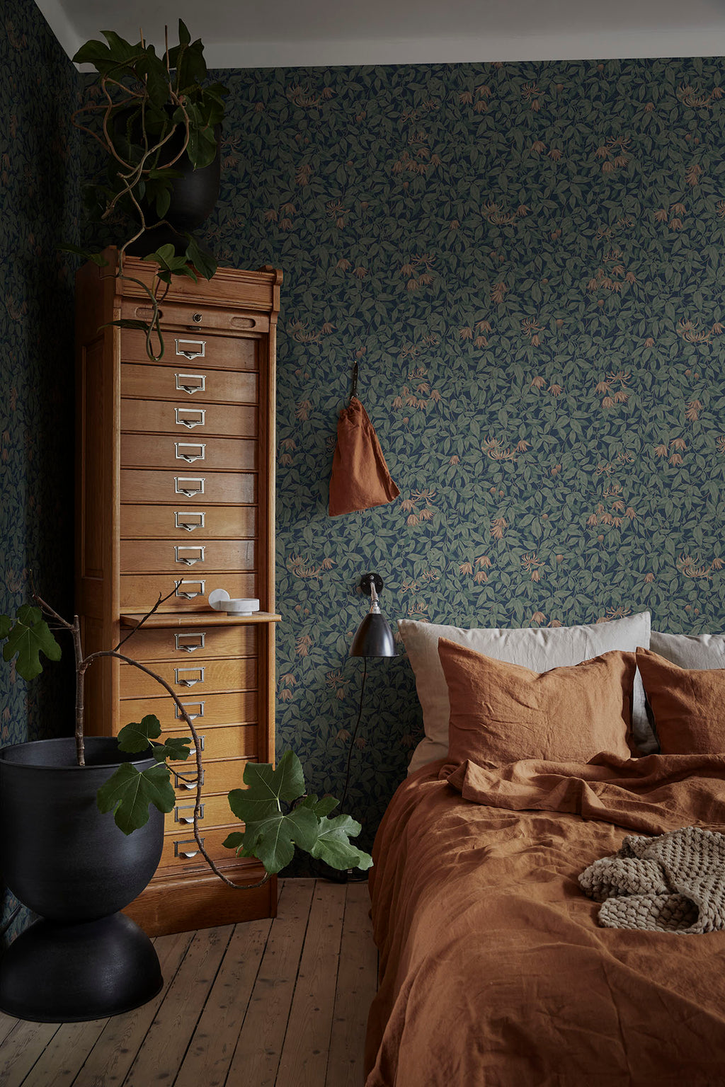 Linnea wallpaper by Sandberg in Midnight Blue, styled on an interior wall