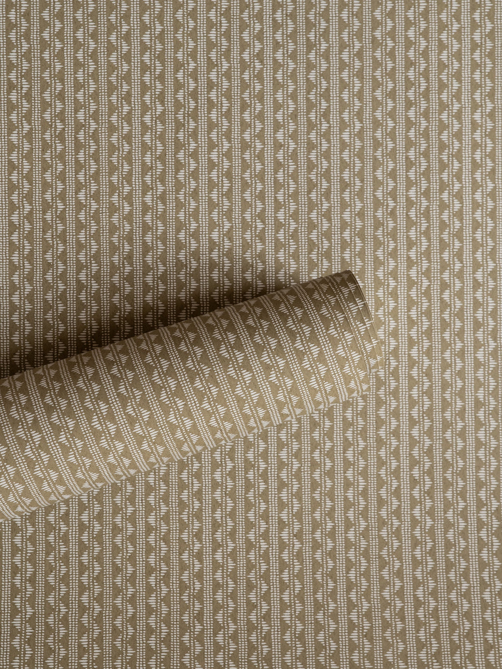 Zigzag wallpaper by Långelid/von Brömssen in Beige – geometric design, a part-rolled length showing the woven zigzag