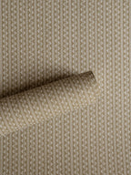 Zigzag wallpaper by Långelid/von Brömssen in Beige – geometric design, a part-rolled length showing the woven zigzag