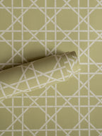 Trellis wallpaper by Långelid/von Brömssen in Green – geometric design, a part-rolled length showing the cane lattice