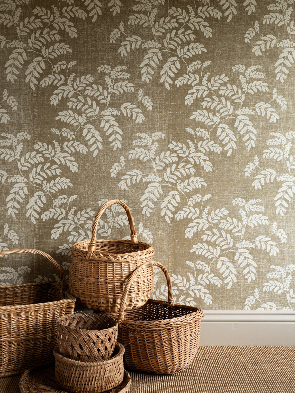 Acacia wallpaper by Långelid/von Brömssen in Beige – botanical design, with a group of wicker baskets