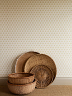 India wallpaper by Långelid/von Brömssen in Yellow – floral design, with rattan trays and baskets