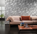 Facet wallpaper by Arte in Grey – Pigeon behind a blush sofa and a copper coffee table
