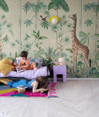 Giraffe's Stroll wallpaper by Rebel Walls in Light Green, styled on an interior wall