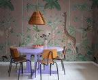 Giraffe's Stroll wallpaper by Rebel Walls in Pink, styled on an interior wall