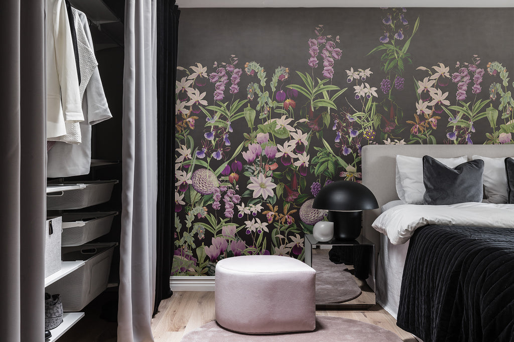 Alice's Garden Mural by Rebel Walls in dark colourway styled in a bedroom beside a walk-in wardrobe