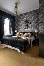 Saint Sebastian wallpaper by Rebel Walls in Grey – Graphite, styled room