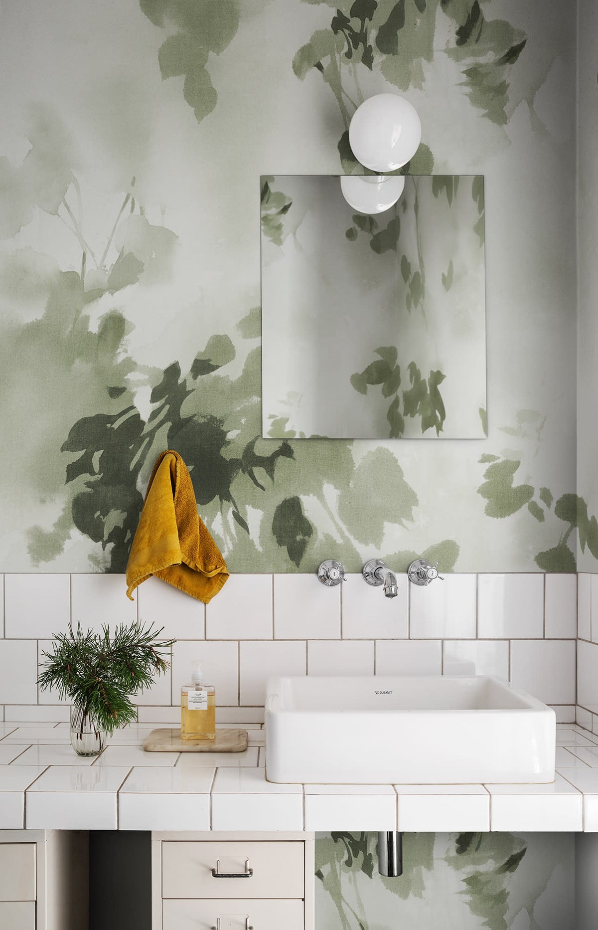 Hazy Leaves wall mural by Rebel Walls in Green, styled room